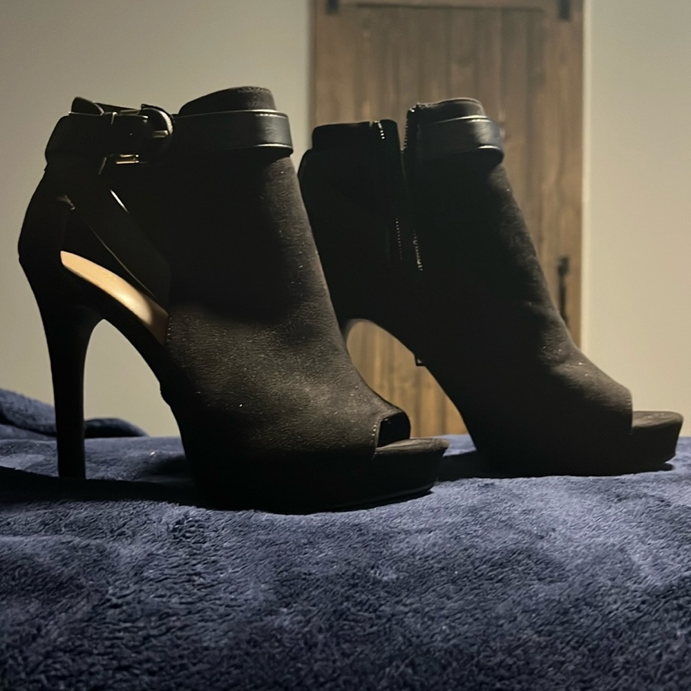 Black peep toe high heel shoes.